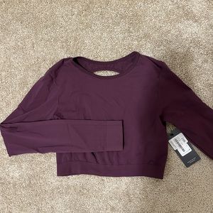 Long sleeve, cropped workout top. Size M/L.